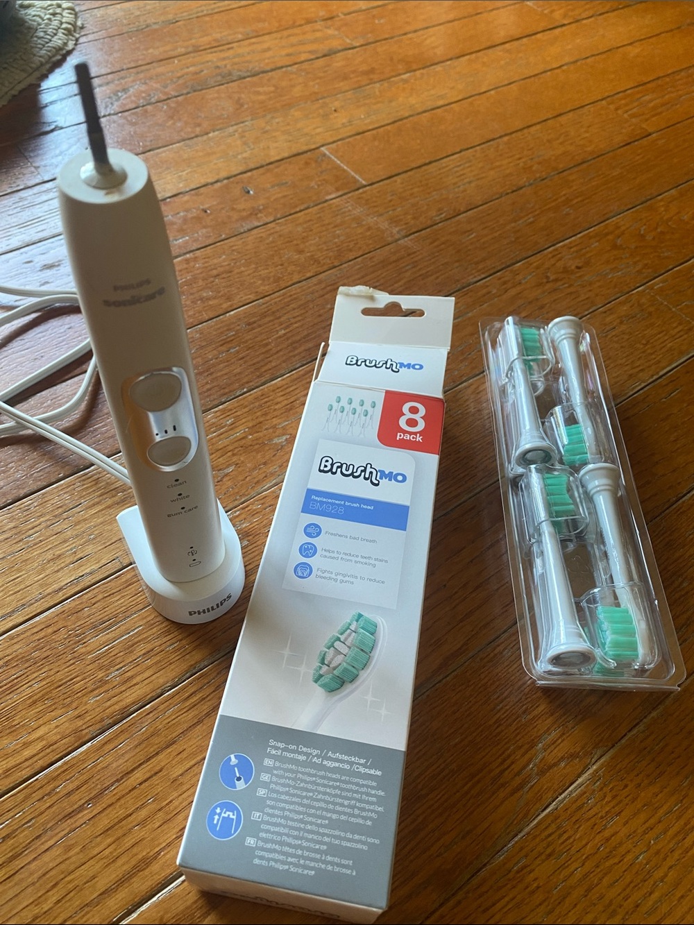 Philips Sonicare White Electric Toothbrush Handle with Replacement Brush Heads